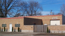 Representative photograph of a block masonry contractor shop with overhead doors